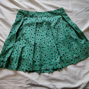 Collective Concepts Green Bird Print Pleaded A Line Mini Tennis Skirt w/…